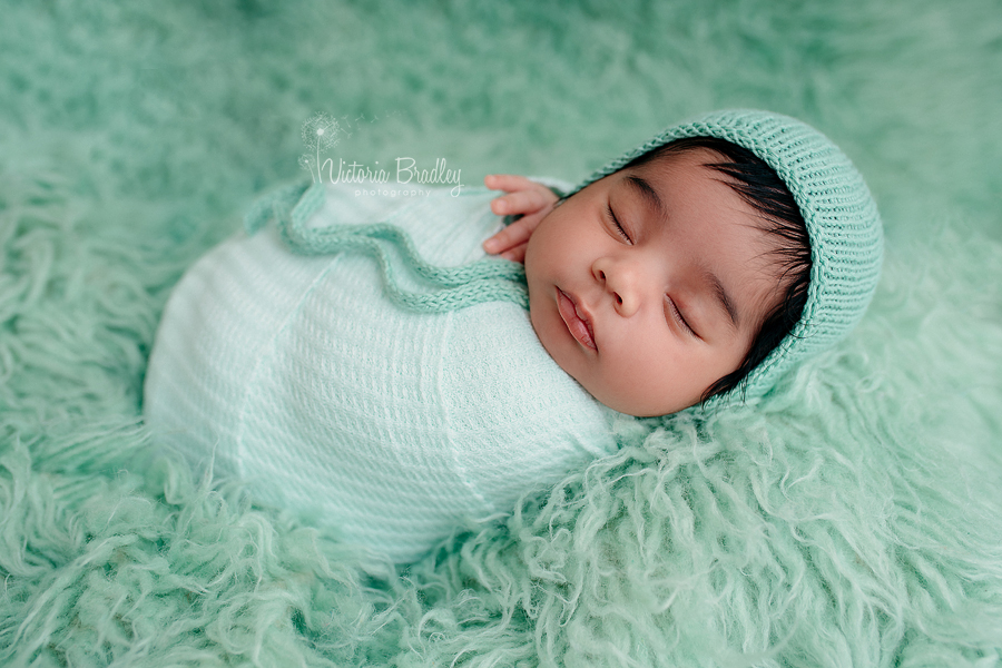 wrapped newborn in mint wrap