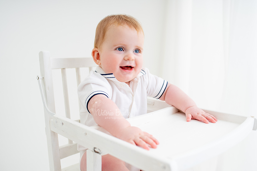 sitter baby in white high chair