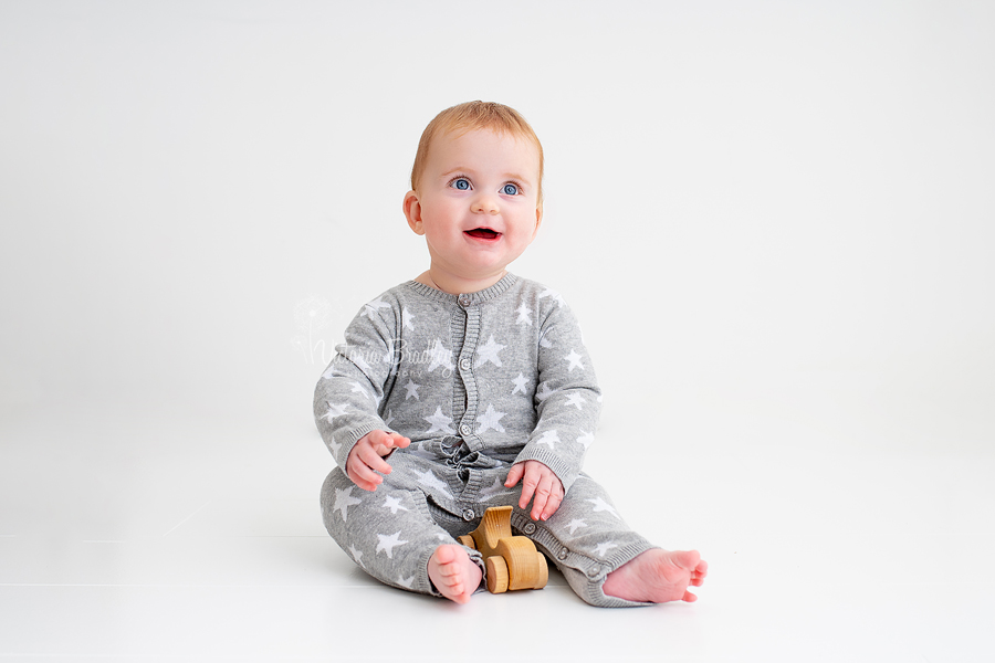 sitter baby boy in grey and white starred romper