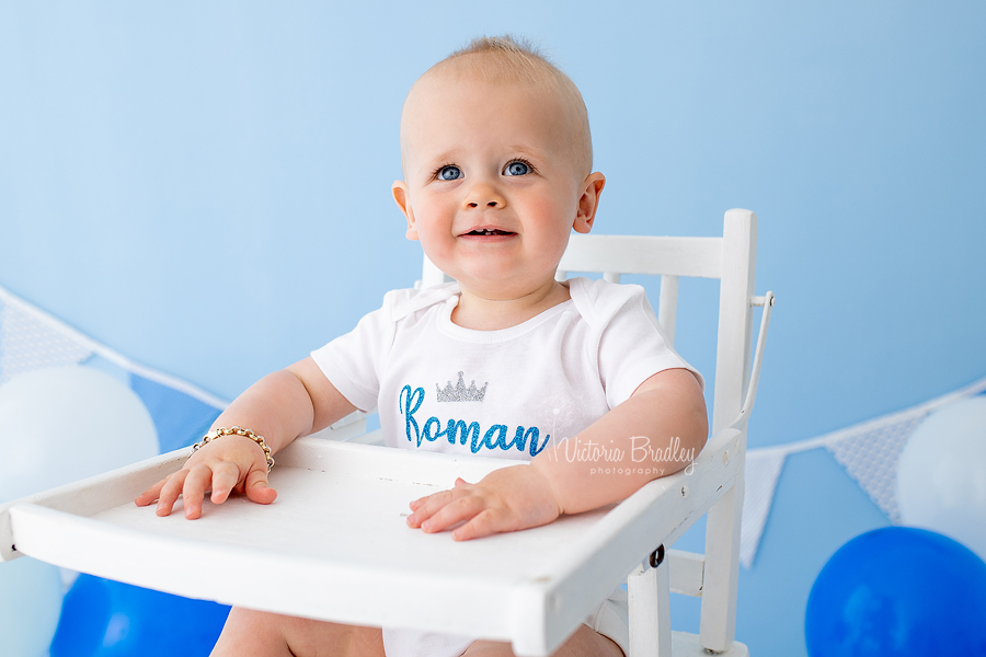 baby boy cake smash in high chair