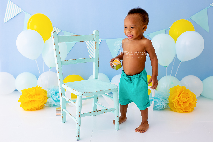 blue, yellow, green baby boy cake smash