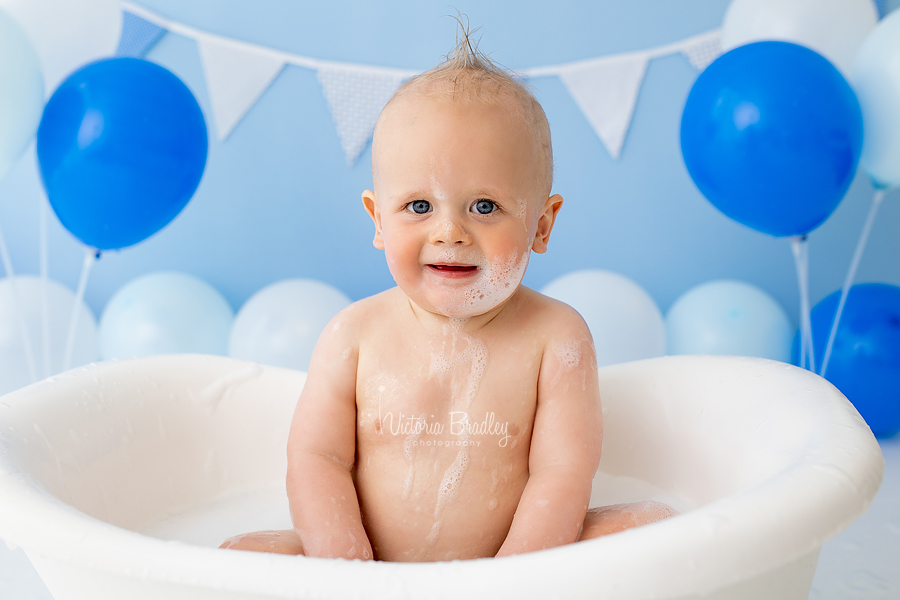 baby boy in bath tub blue cake smash