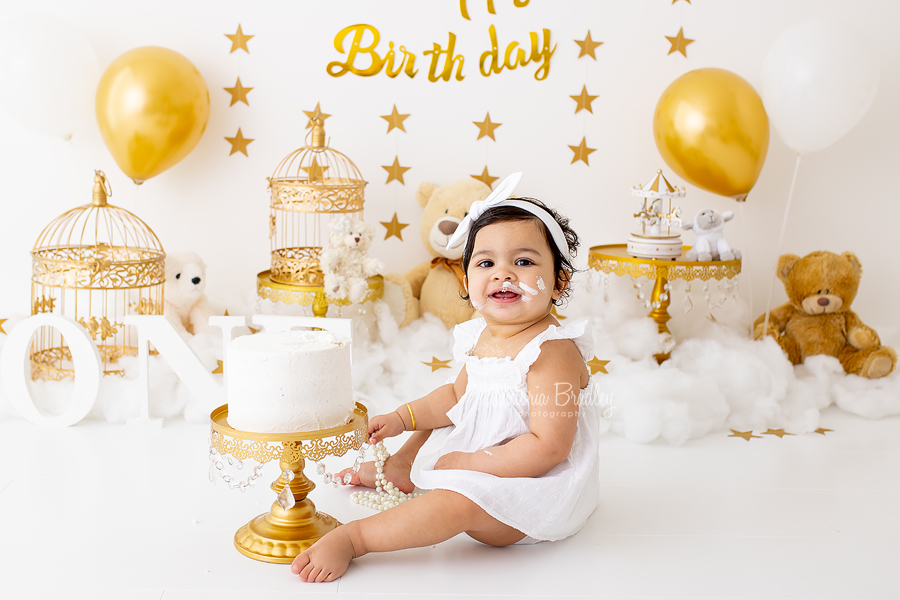 first birthday gold and white cake smash