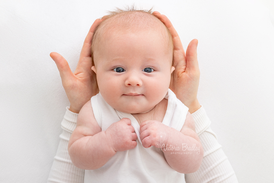 baby boy in mummy's hands