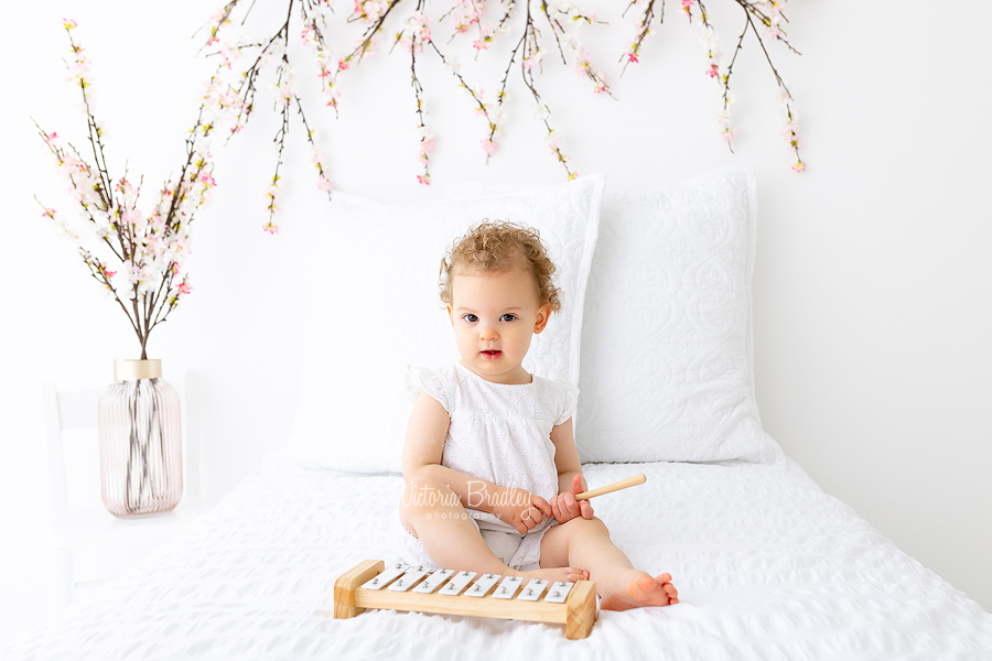 baby on white with blossom