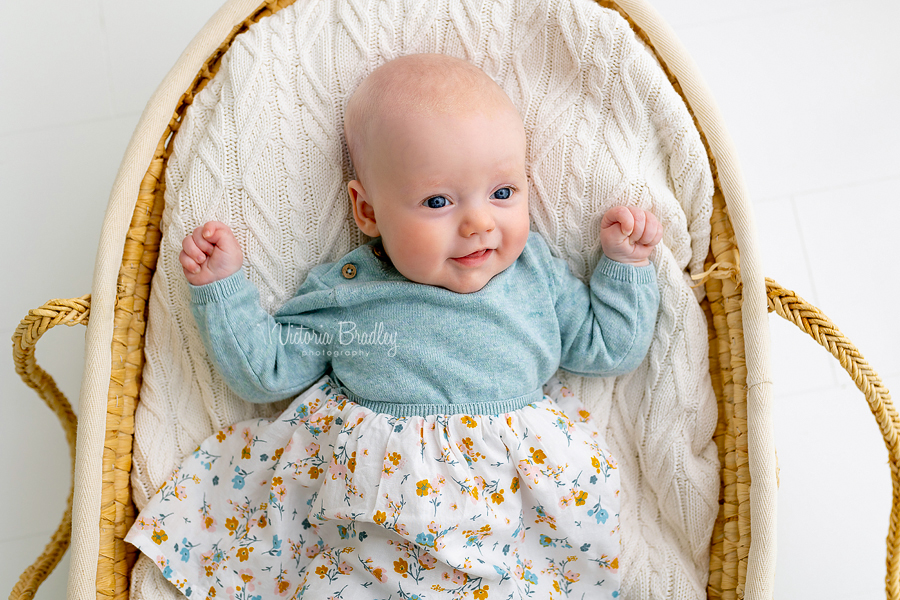 newborn baby in Moses basket