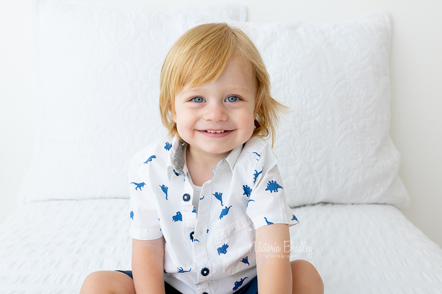 toddler photograph on white bed