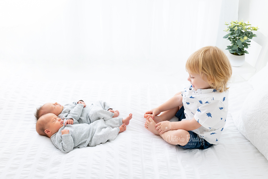 newborn twins with toddler