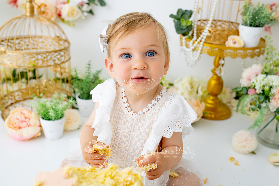 smiley baby eating cake