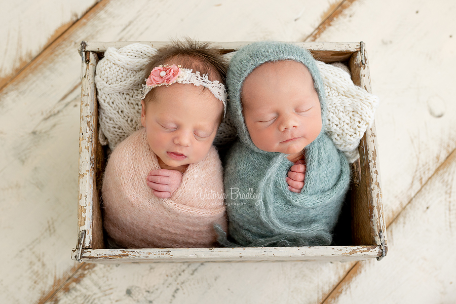 twins wrapped in crate