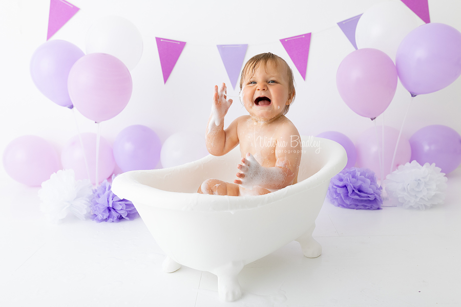 baby in bath tub lilac cake smash