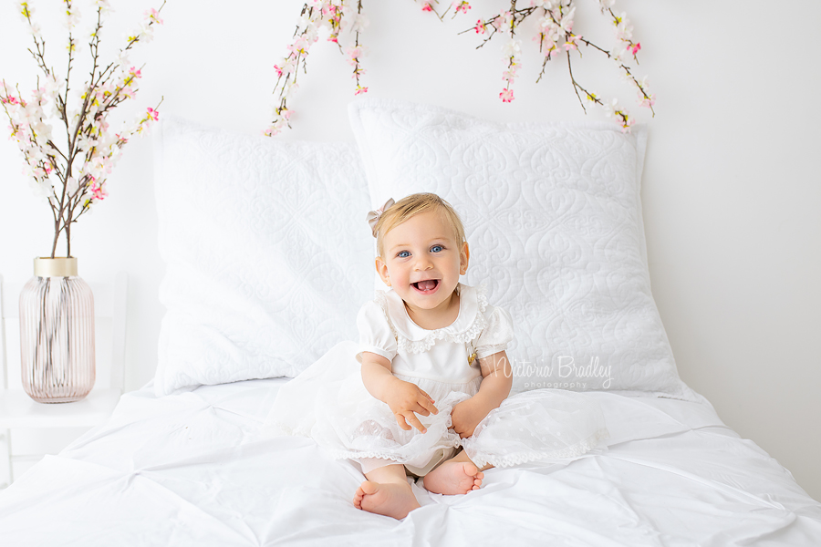 pink blossom and white bed 