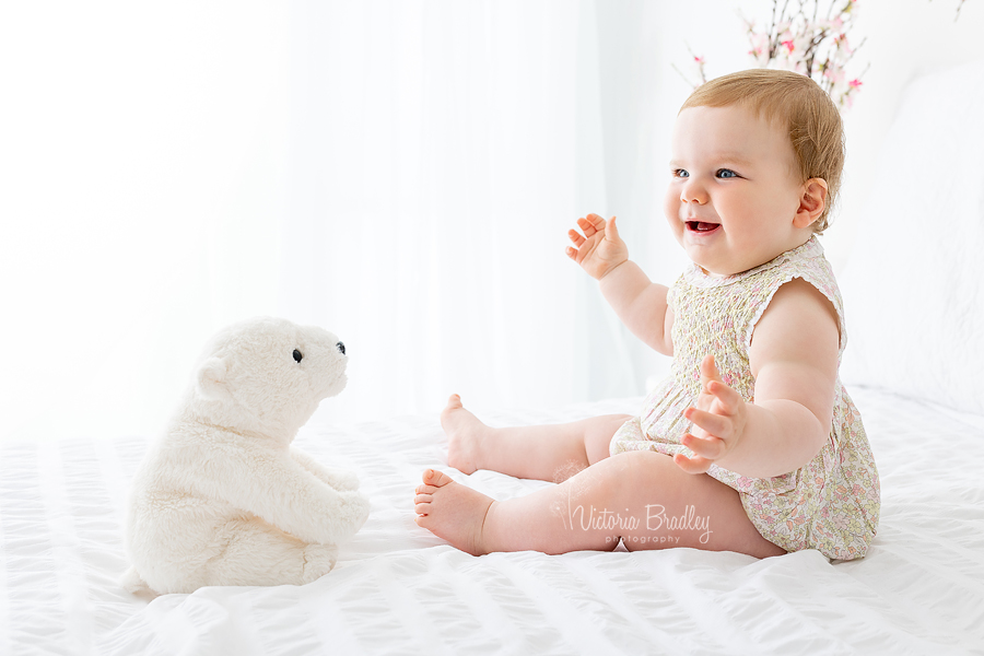 baby with polar bear toy