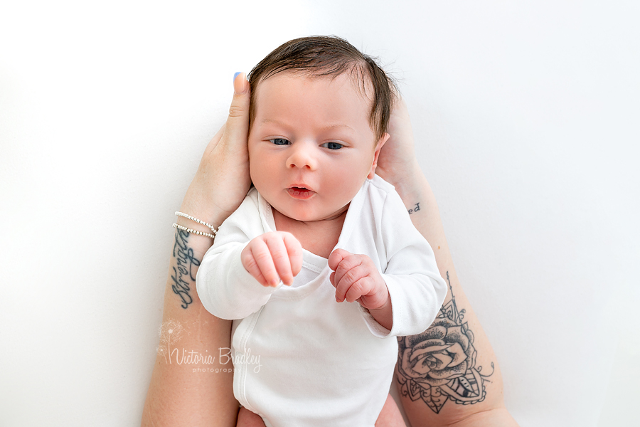 newborn photography in mummy's hands