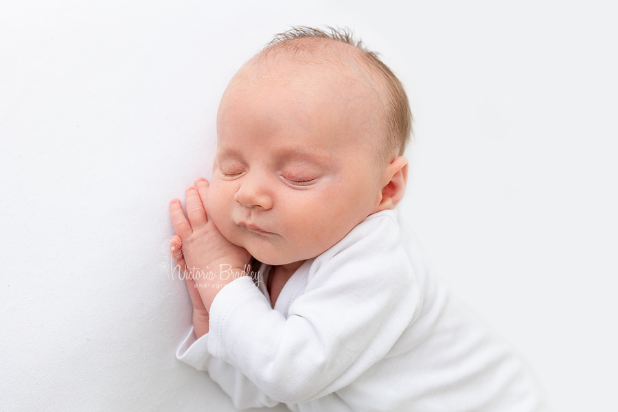 sleepy newborn on side