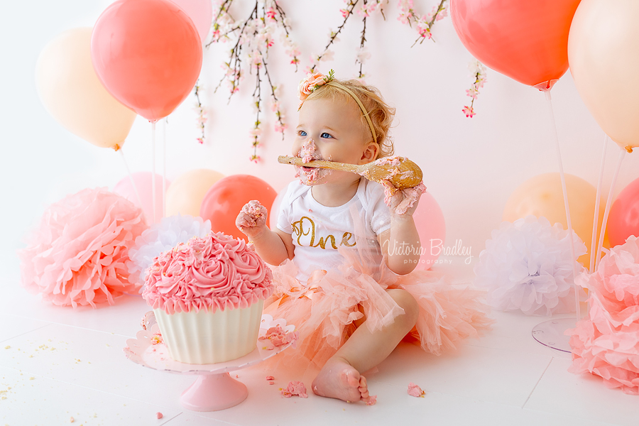 peachy pink girl cake smash