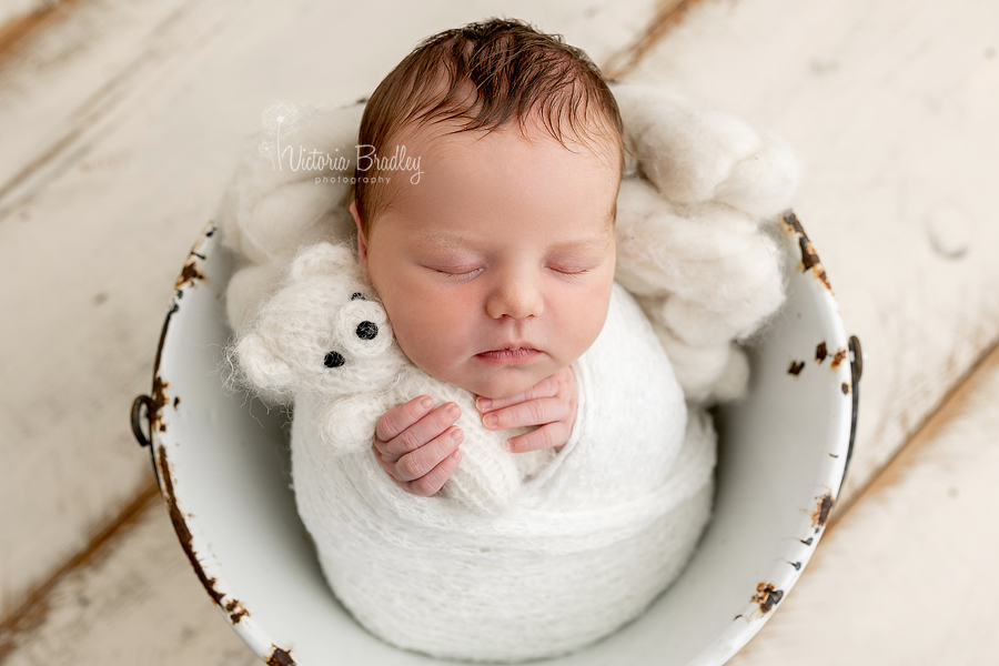 wrapped newborn in bucket