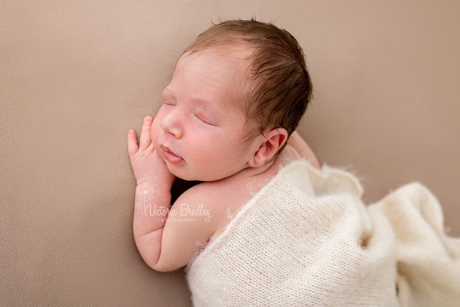 newborn boy on tummy photography 