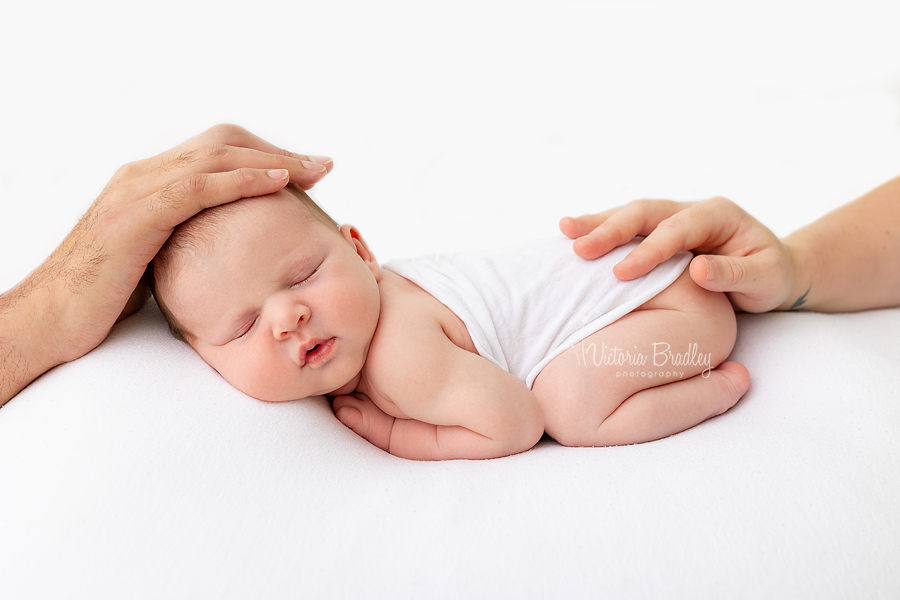 Mummy & Daddys hands on newborn