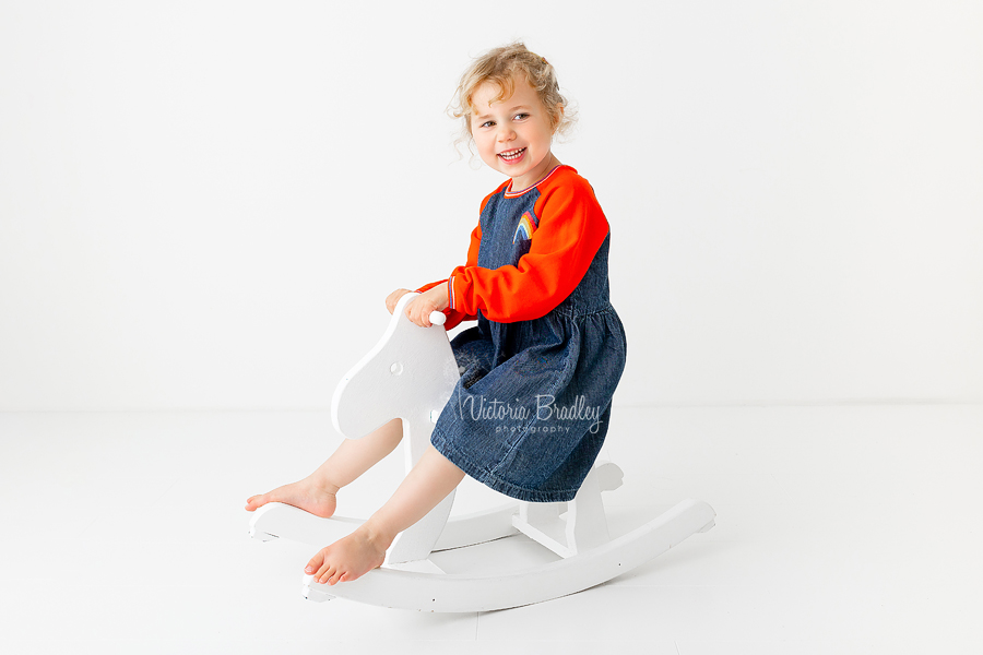 4 year old girl on rocking horse