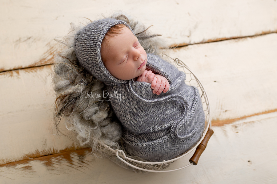 wrapped baby in grey
