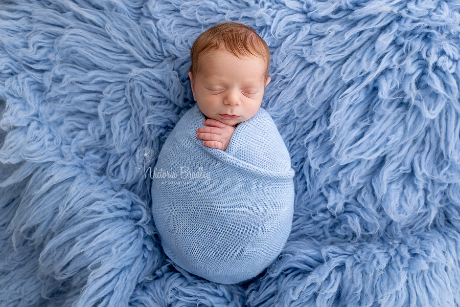wrapped baby photography in blue