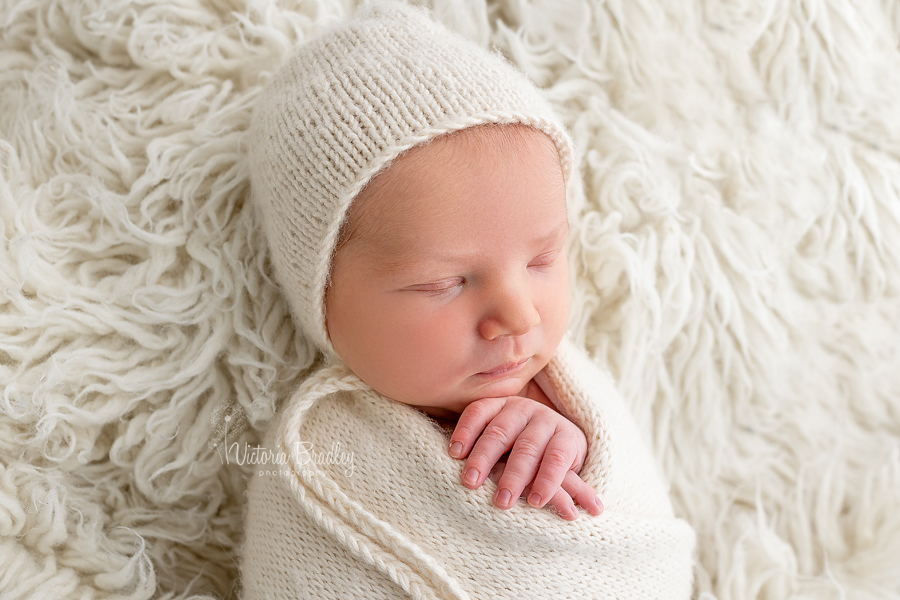 sleepy wrapped newborn