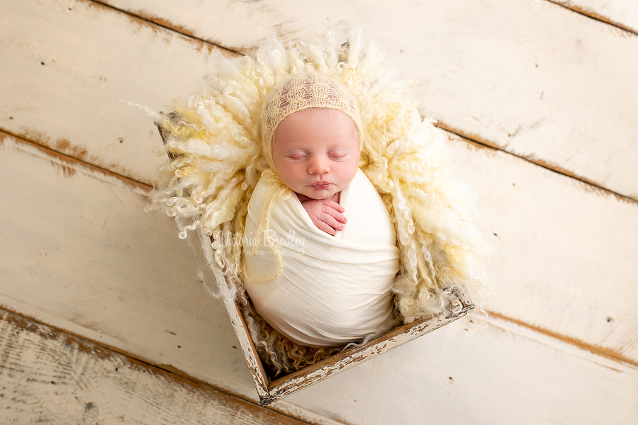 wrapped newborn in yellow