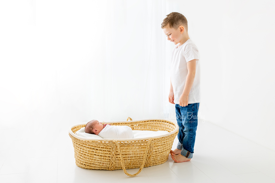 sibling boy and baby girl moses basket