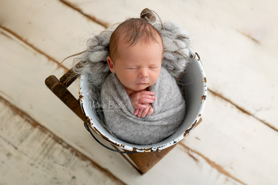 wrapped newborn in bucket