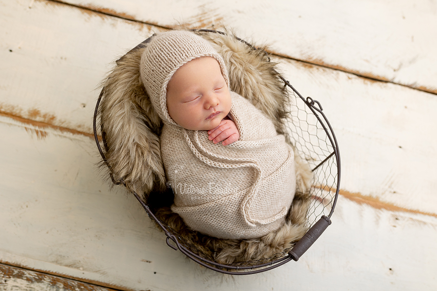 wrapped newborn in basket