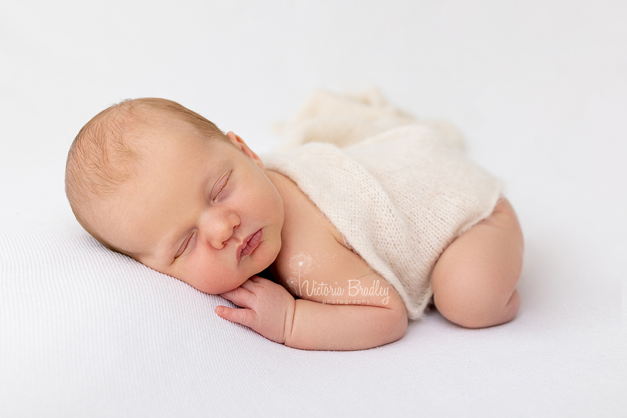 baby newborn asleep on tummy photography