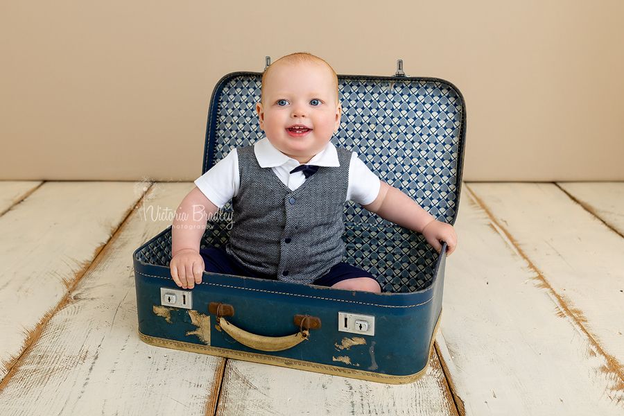 1 year old baby boy in suitcase