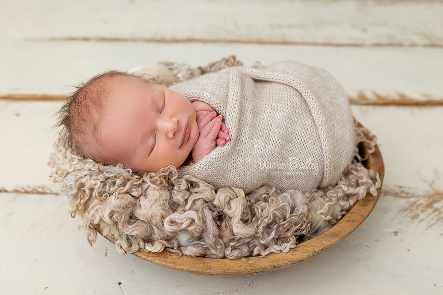 smiling wrapped newborn photography