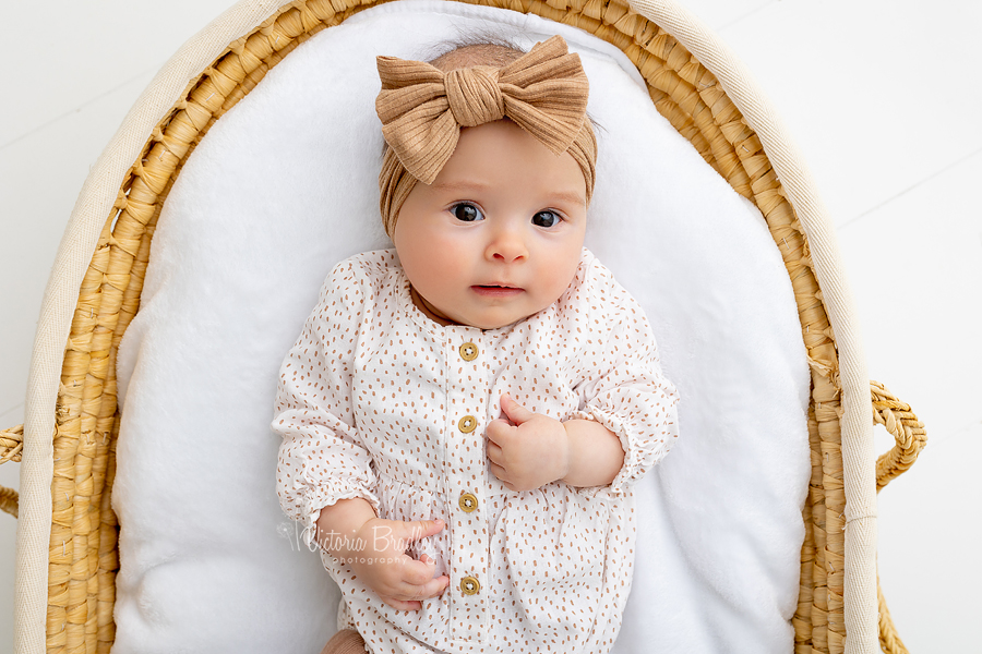 newborn in moses basket