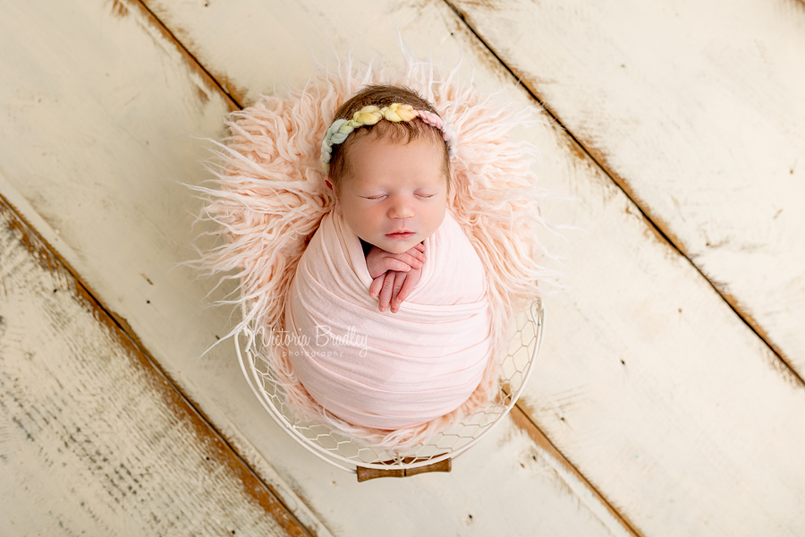 wrapped newborn in basket