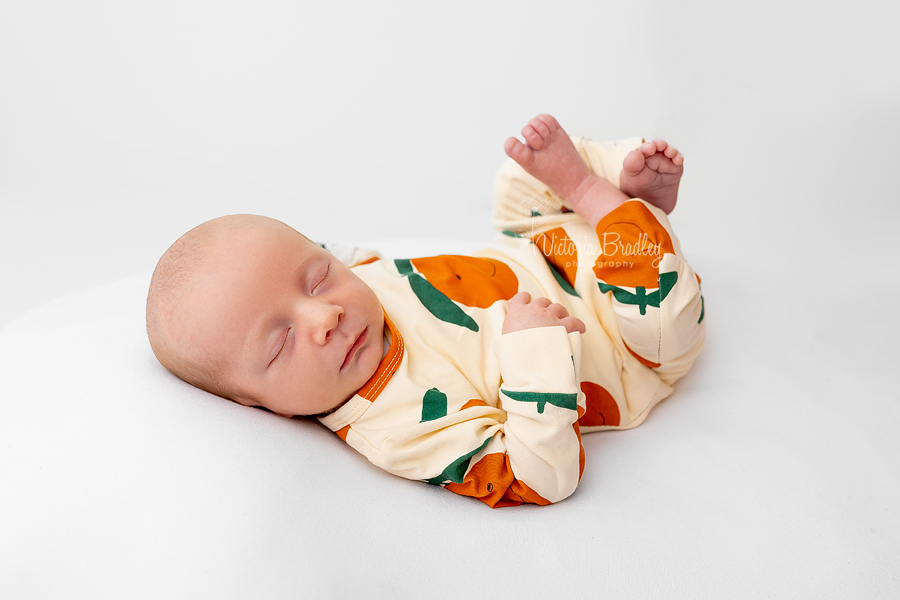 newborn baby boy on white backdrop