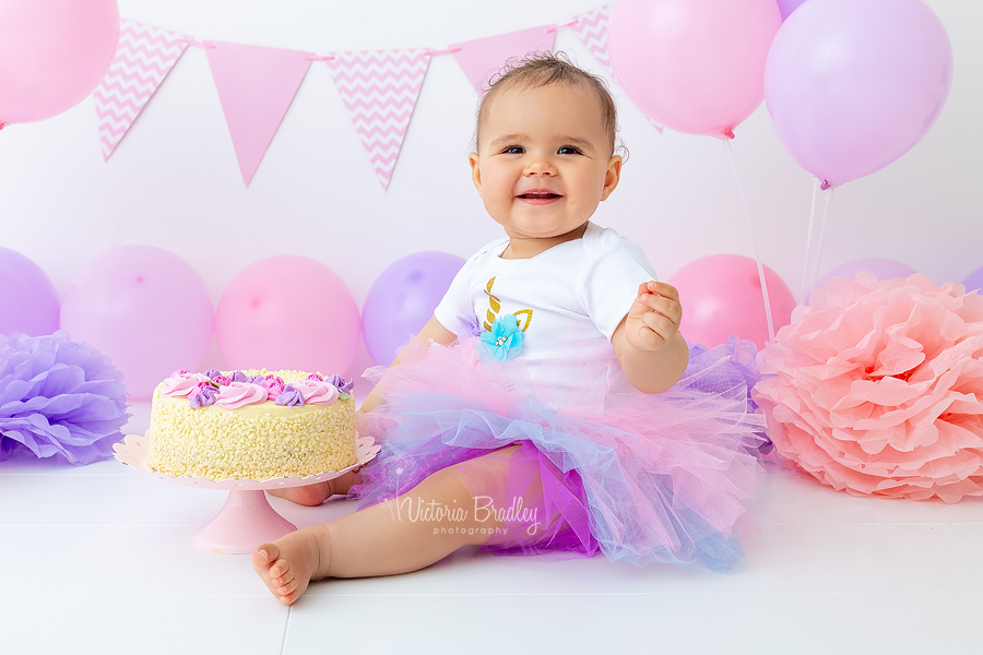 first birthday cake smash, pinks and purple with flower cake