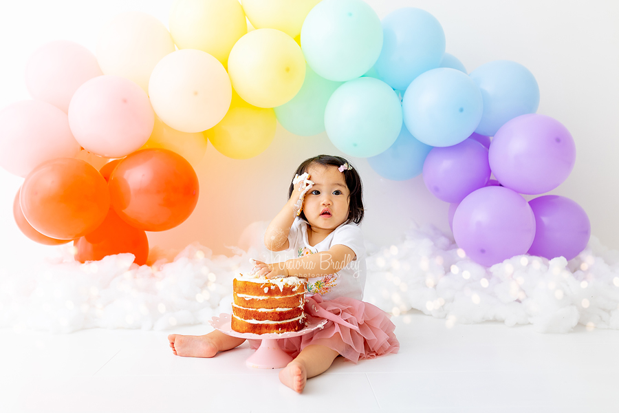 cake smash rainbow balloons arch