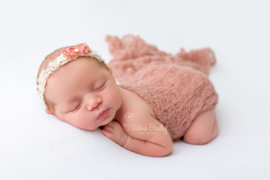 newborn asleep on tummy photography