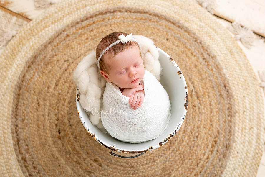 wrapped baby in bucket