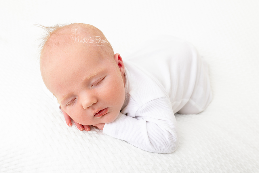 pure newborn chin on hands