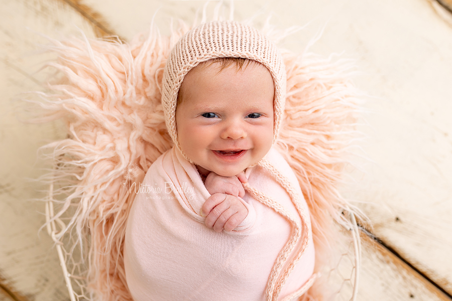 smiling 4 week old baby girl