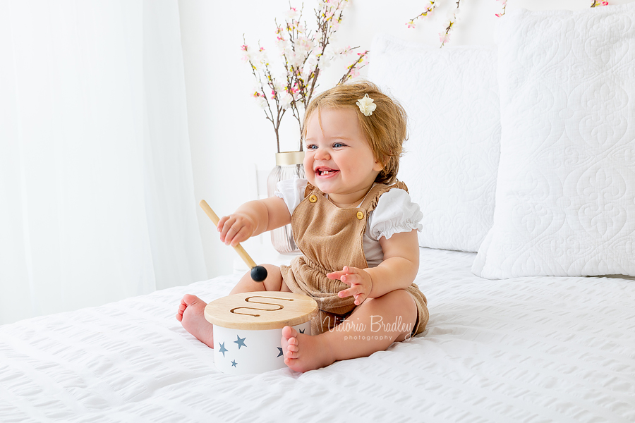 baby girl playing drum