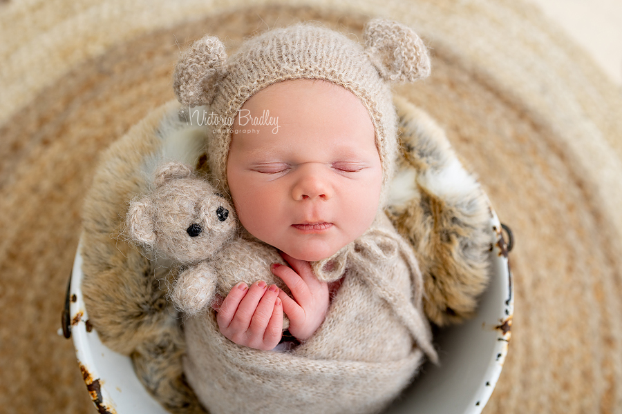 wrapped newborn with bear hat